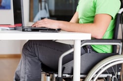 Young man on wheelchair studying in his room Young man on wheelchair studying in his room