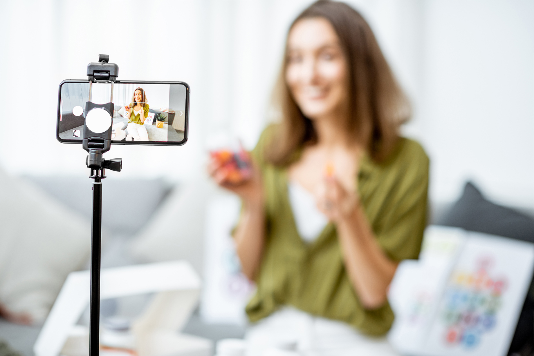 Woman recording an instructional video on a mobile device